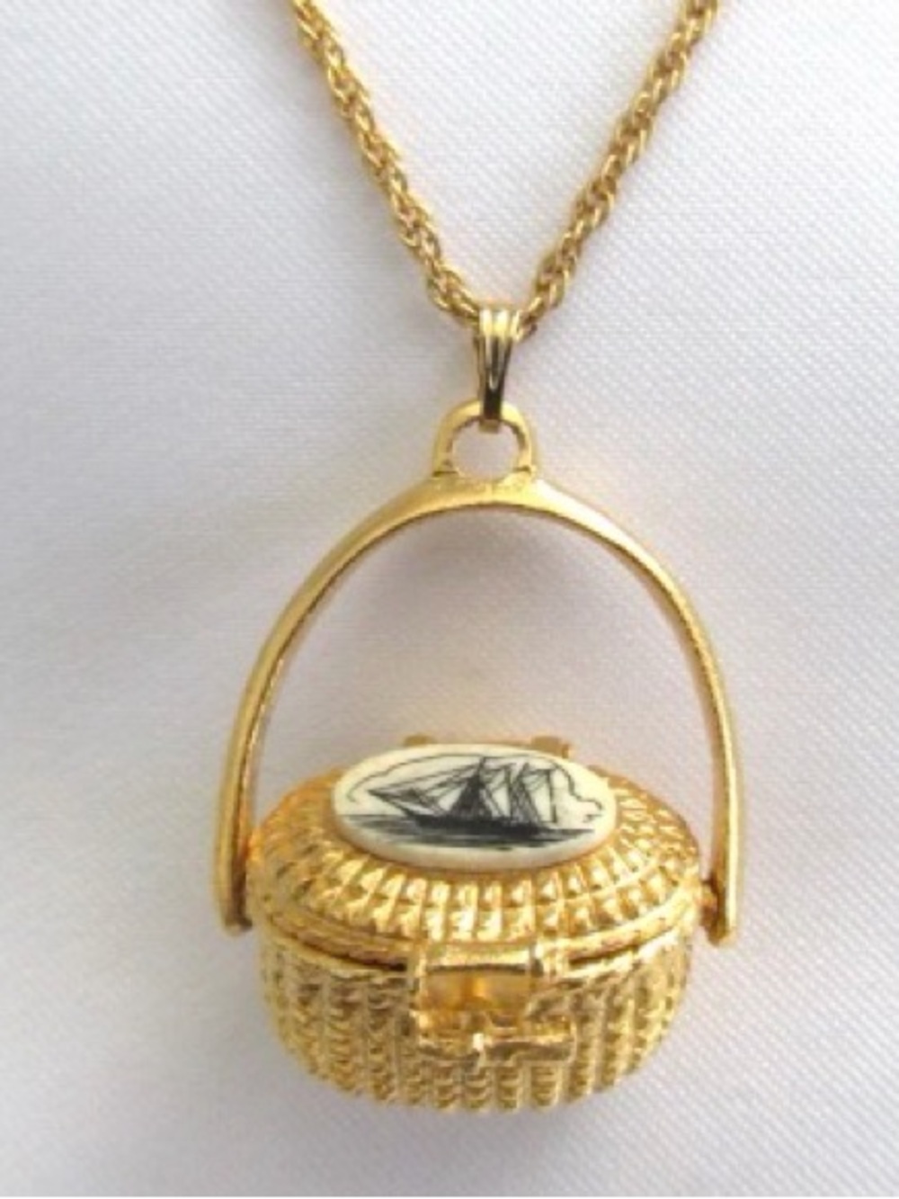 Nantucket Basket gold plated pewter with penny inside.  Chain not included.